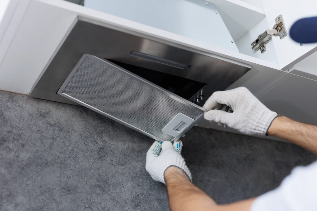 Man performing dryer vent maintenance